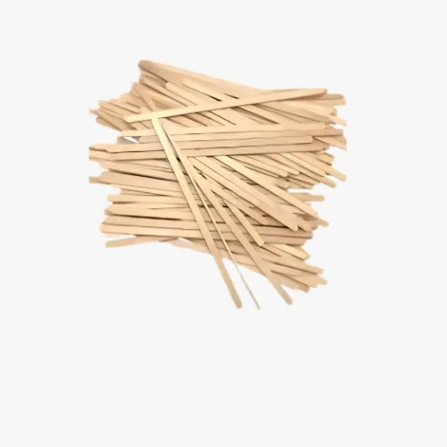 Pile of wooden craft sticks scattered on a white background.