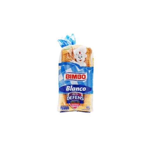 Loaf of Bimbo Blanco bread in blue and white packaging featuring a white dog mascot.